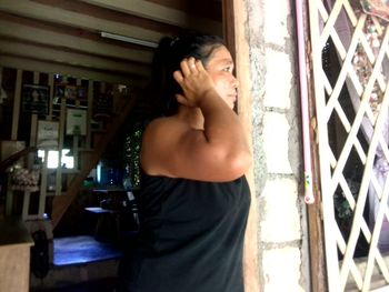 Young woman looking at home