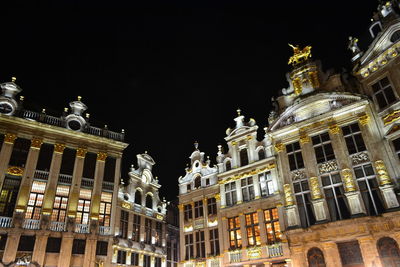 Low angle view of illuminated buildings at night