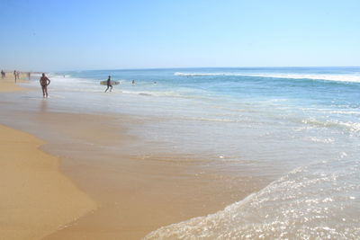 Scenic view of beach against clear sky