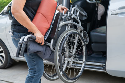 Midsection of man riding bicycle