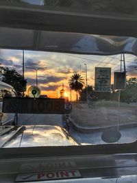 Car on road against sky during sunset