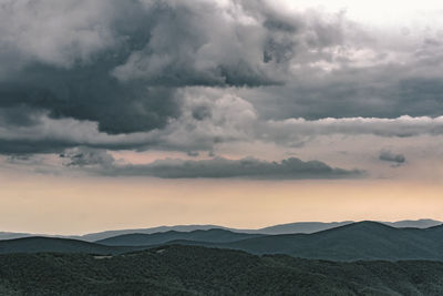 Scenic view of mountains against sky during sunset