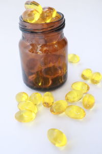 Close-up of fruits in glass jar on table