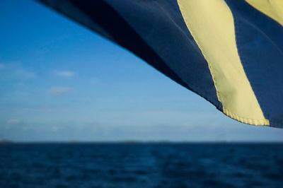 Close-up of blue sea against sky