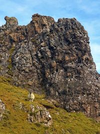 Rock formation on land against sky
