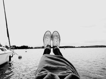 Low section of people relaxing on beach