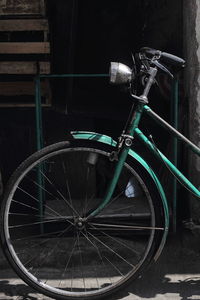 Bicycle parked against wall