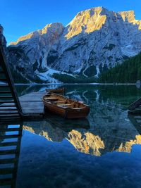 Scenic view of lake by snowcapped mountains