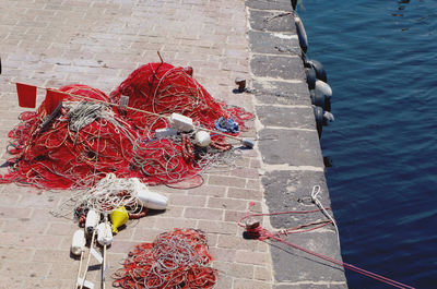 High angle view of fishing net on pier