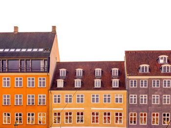 Residential buildings against clear sky