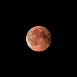 Low angle view of moon against sky at night