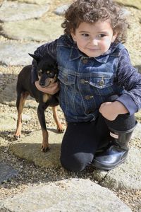 Cute girl with dog outdoors