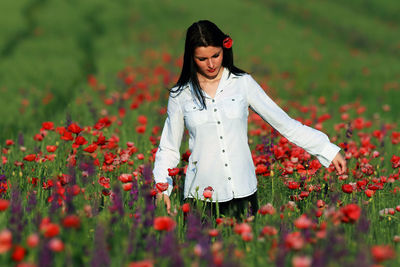 Beautiful woman standing on field