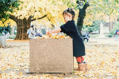 Full length of woman standing in autumn