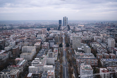 High angle view of modern buildings in city against sky