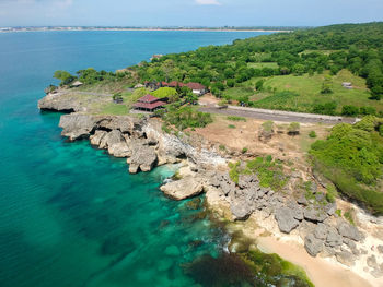 High angle view of rocks on beach against sky