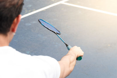 High angle view of man playing badminton