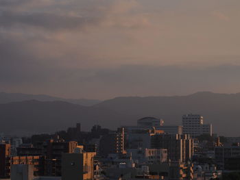 Cityscape against sky during sunset