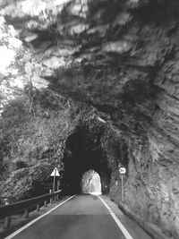 Road amidst trees against sky