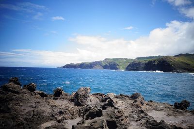 Scenic view of sea against blue sky