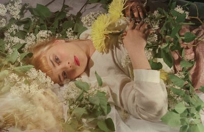 High angle view of child on flowering plants