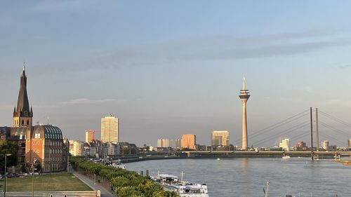 Bridge over river with buildings in background