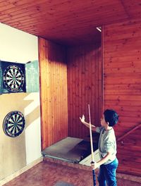 Boy standing against sports target