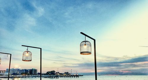 Street light against sky at sunset