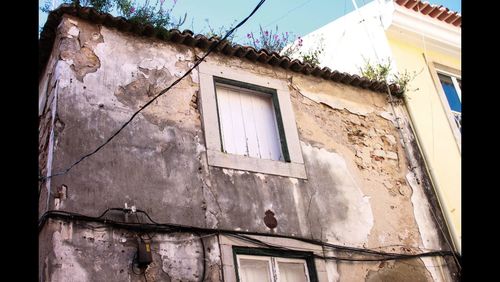 Low angle view of abandoned house