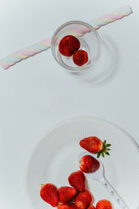 High angle view of strawberries in glass on table