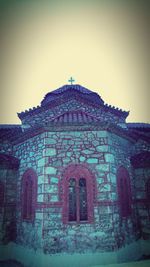 Low angle view of built structure against blue sky