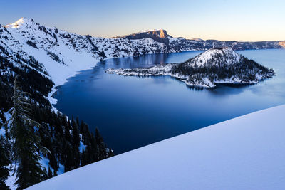 Winter at crater lake and wizard island during sunset
