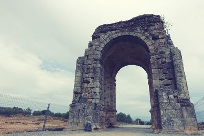 Low angle view of old ruins against sky