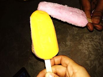 Close-up of man holding ice cream