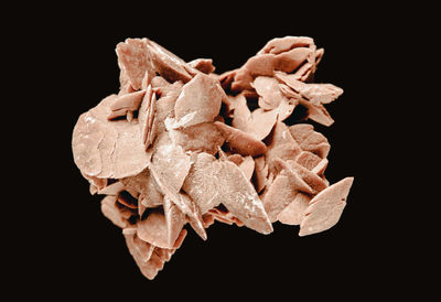 Close-up of dry leaves against black background