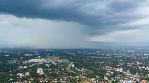 Aerial view of cityscape against sky