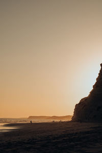 Scenic view of sea against clear sky during sunset