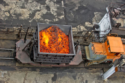 High angle view of engine on tracks at factory