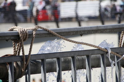 Close-up of rope on railing during winter