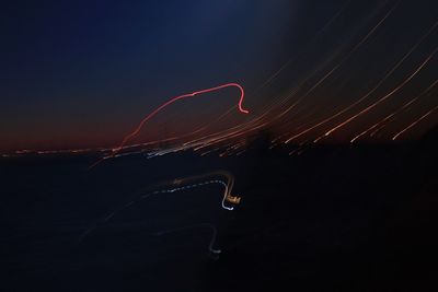 Light trails in sky at night