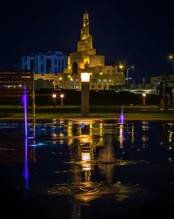 Illuminated buildings in city at night