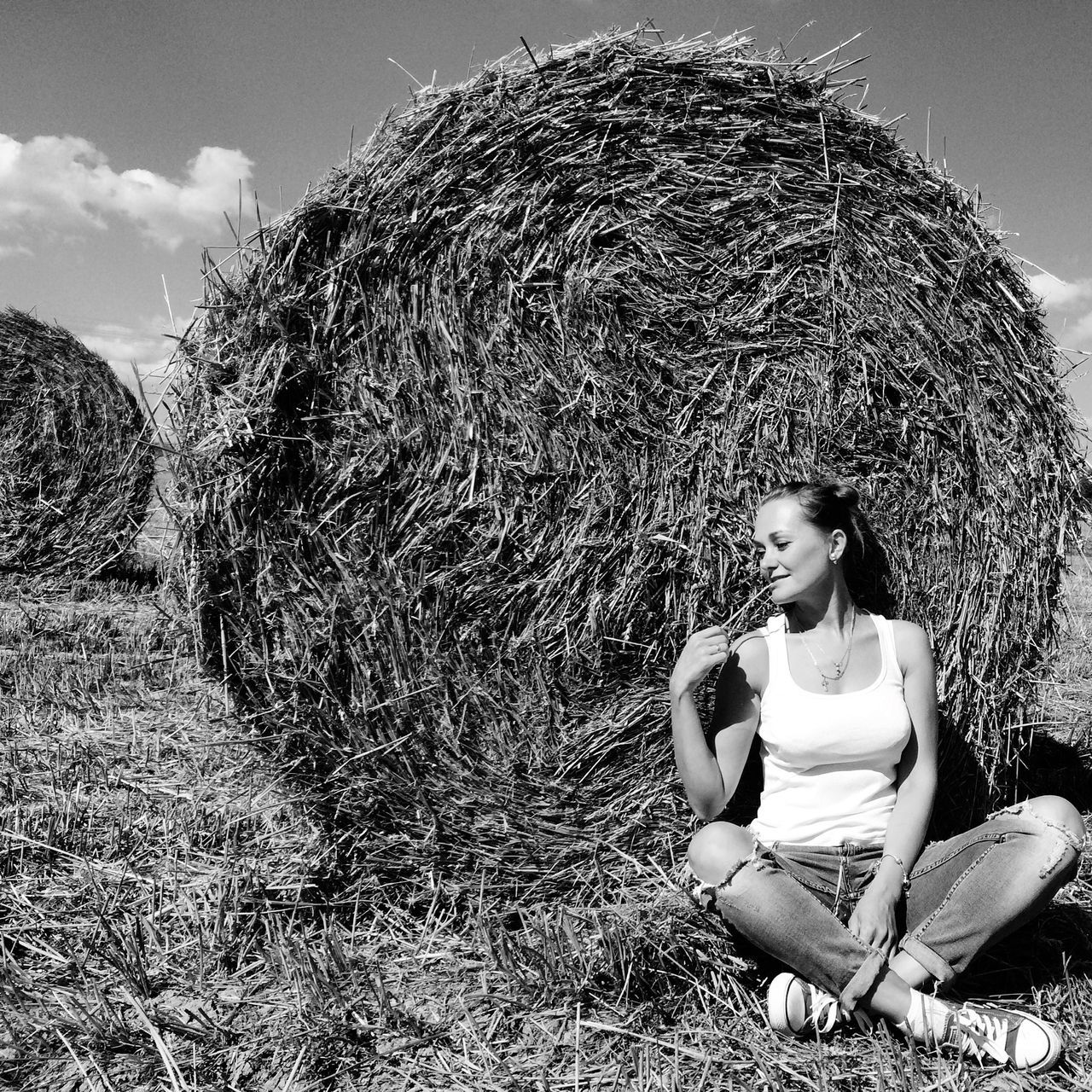 field, grass, sky, leisure activity, landscape, lifestyles, agriculture, rural scene, nature, childhood, grassy, outdoors, tranquility, day, sunlight, farm, hat, rear view