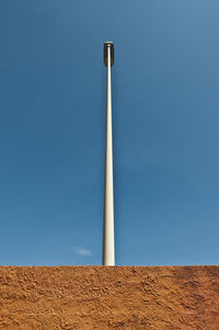 Low angle view of street light against clear blue sky