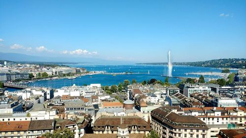 View of cityscape against blue sky