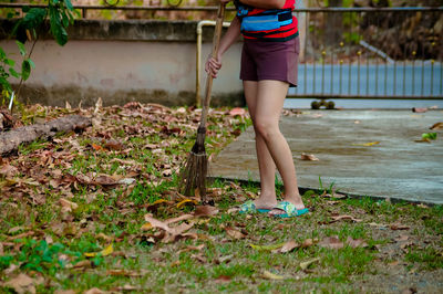 Low section of woman standing on ground