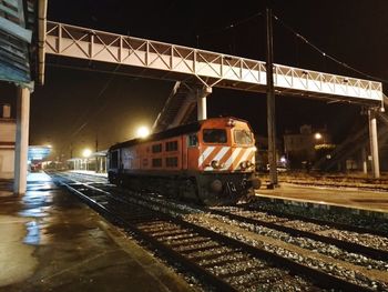 Train at railroad station at night