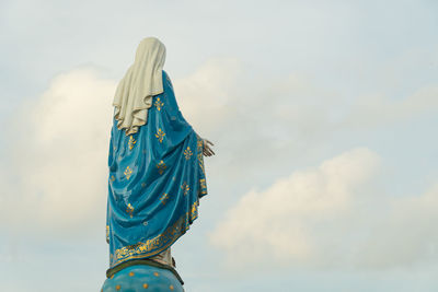 Low angle view of statue against sky