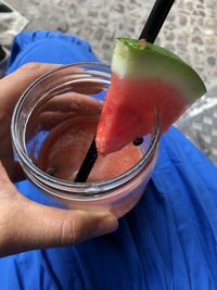 Close-up of hand holding drink