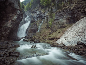 Scenic view of waterfall in forest