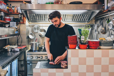 Man cutting meat